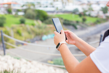 Woman hand selecting content on a smart phone