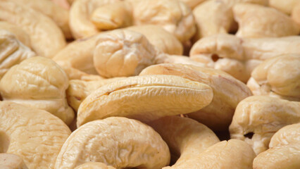 Heap of cashew nuts extreme macro panorama