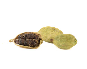 Green cardamom pods with seeds on a white background.