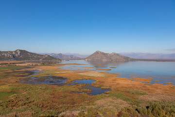 Panoramic view of Lake Skadar National Park in autumn seen from Virpazar, Bar, Montenegro, Balkans, Europe. Travel destination in Dinaric Alps near the Albanian border. Stunning landscape and nature