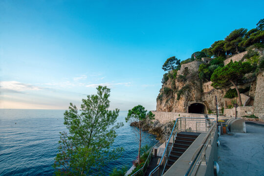 View on Fort Antoine Ian Theatre and Pescher tunnel  and Mediterranean Sea. Idyllic pine trees on rock in morning of summer on Monaco