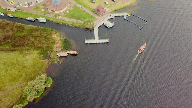 An Indian hay boat sailing on Lake San Pablo Ecuador