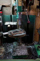 Part machining with drilling machine