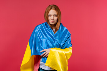 Happy woman with national Ukrainian flag on pink. Ukraine, patriot, victory in war celebration, banner, Independence day