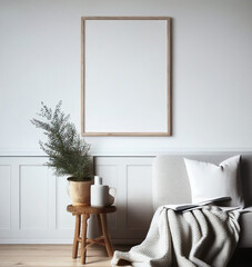 Empty vertical picture frame mockup. Midcentury linen sofa with linen blanket. Wooden pot with pine plant.  White wall background. Scandinavian interior