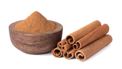 Cinnamon spice. Cinnamon sticks. Cinnamon powder in a wooden bowl.