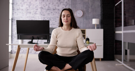 Fototapeta na wymiar Employee Doing Mental Health Yoga Meditation