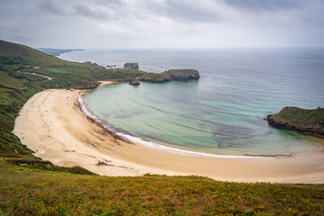 Views of the Ballota beach in a cloudy day