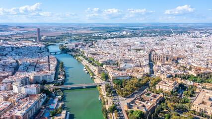 Fototapeta premium Aerial view of the Spanish city of Seville in the Andalusia region on the river Guadaquivir overlooking the cathedral