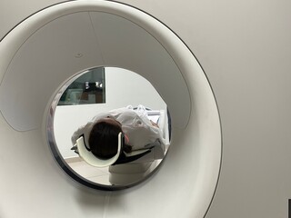 Woman having CT scan Tomography of the in hospital