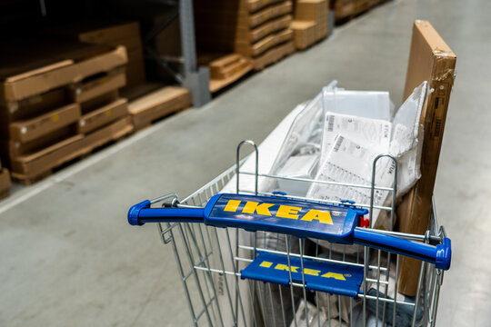Belgrade, Serbia - January 02, 2023: Shopping cart with Ikea logo in store warehouse