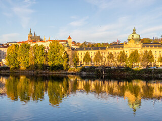 Fototapeta premium Colors of autumn Prague. Picturesque autumn colors on the embankment by the Vltava river, Prague, Czech Republic