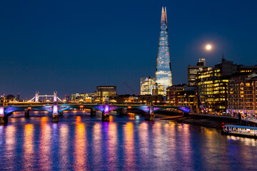 The Shard in London at night over the Thames
