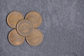 10 japanese yens coins on grey background