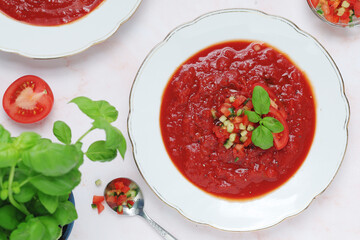 Plates with traditional gazpacho tomato soup	