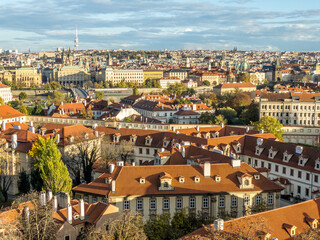 Fototapeta na wymiar View of Prague. View from the gardens and vineyards of Prague Castle to picturesque Prague in the autumn setting sun. Prague, Czech Republic