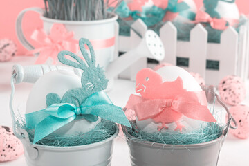 Easter decor with selective focus. Holiday still life with decorative eggs in a bucket with copy space for text