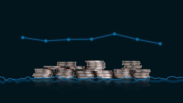 The concept of a faltering economy. a pile of coins and a graph.
