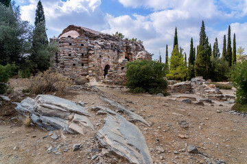 Ayios Marcos temple or Fragomonastiro is a three aisled early Christian basilica with a narthex located at the archaeological site of Taxiarches Hill in Kaisariani district, Athens, Greece, cloudy sky