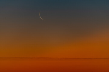 Crescent Moon in Colorful Twilight Sky