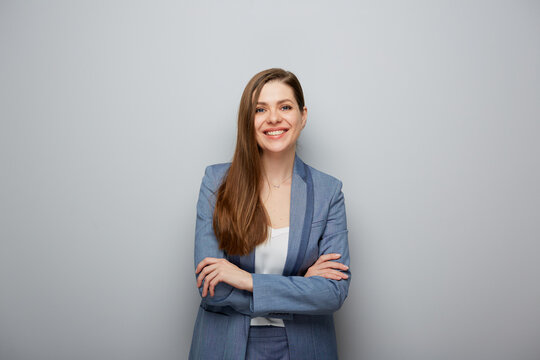 Smiling business woman portrait with arms crossed.