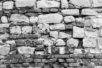 Wall from different stones for background design. A backing with stone masonry for branding, calendar, postcard, screensaver, wallpaper, poster, banner, cover, website. Toned high quality photo