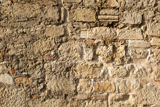 The art texture of old stonewall, close-up. Stone wall for backdrop design. Natural texture from big stones for publication, poster, calendar, post, screensaver, wallpaper, postcard, banner, web.