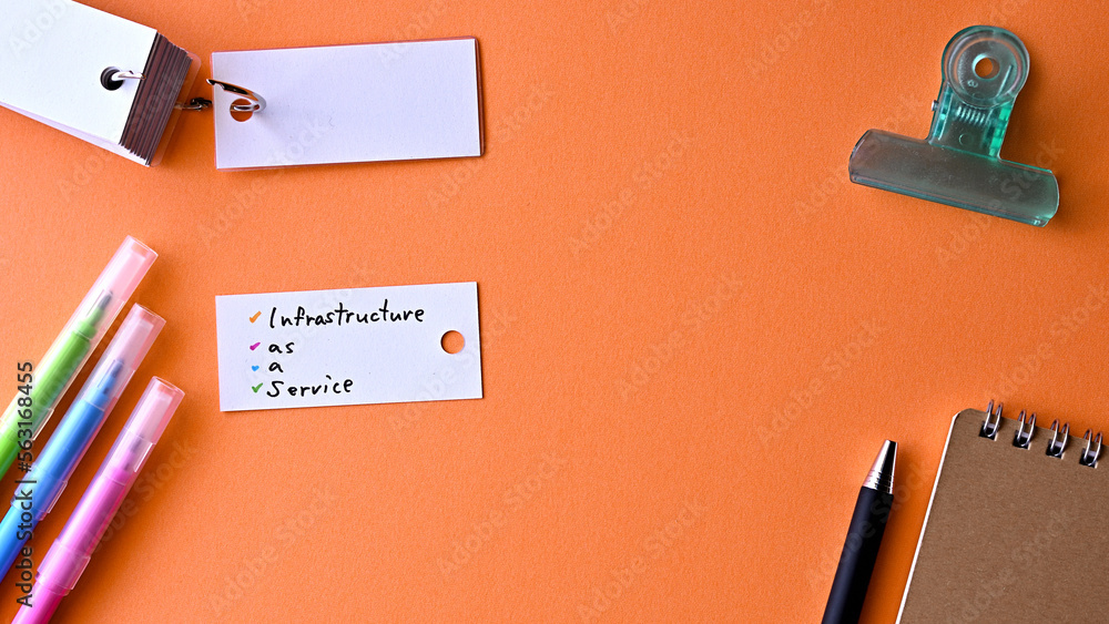 Poster there is a small card placed on a red background paper with the word infrastructure as a service wri