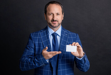 man holding business card with copy space. photo of business man with card, presenting