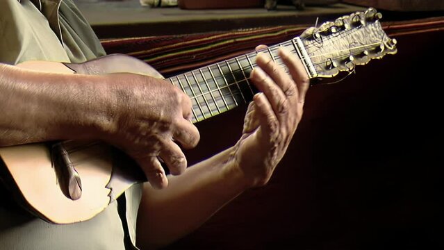 Man Playing a "Charango", Small Andean Stringed Instrument, Jujuy, Argentina. Close Up.