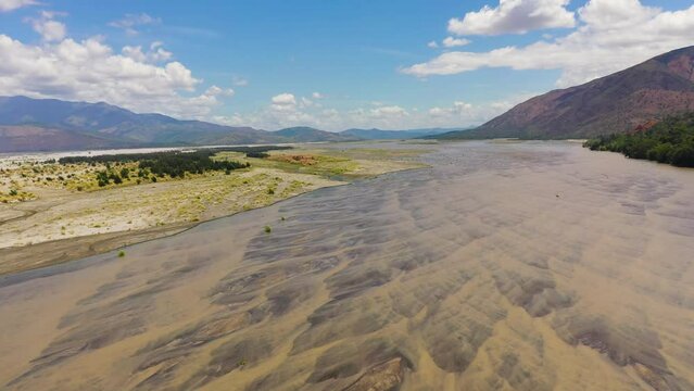 A shallow river bed in a mountain valley. Bucao river. Luzon, Philippines.