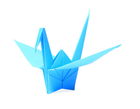 Origami art. Blue handmade paper crane isolated on white