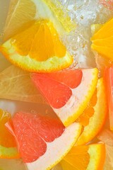 Fresh slices of grapefruit, orange fruit and honey pomelo on white background. Pieces of grapefruit, orange fruit and honey pomelo.