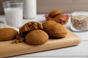 Delicious oatmeal cookies on white wooden table, closeup