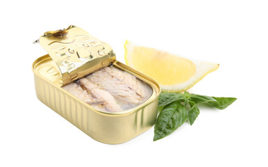 Open tin can with mackerel fillets, lemon and basil on white background