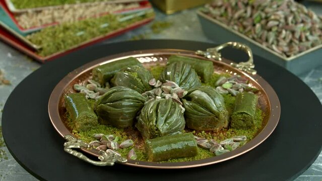 Traditional turkish baklava pistachio pastry. Dilberdudagi, ozel kesim baklava, cikolatali baklava, fistikli baklava, katmer, fistikli kadayif, kattafi, fistik sarma, soguk baklava, midye baklava, cev