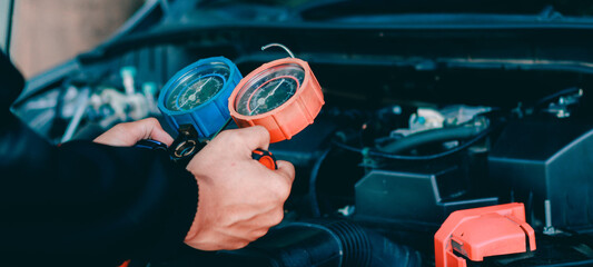 car service worker repairing vehicle , For customers who use cars for repair services .