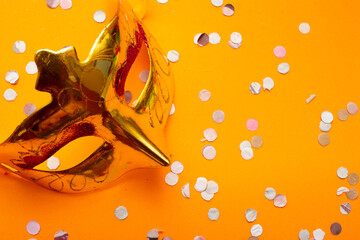 colorful carnival mask on an orange background