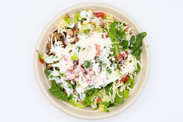 Overhead View of a Chicken Burrito Bowl with Lettuce Cheese and Sour Cream
