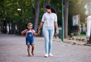 Walking, park and mother holding hands with girl on journey for back to school, learning and class for first day. Love, black family and mom with child walk to kindergarten for education development