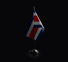 Small national flag of the Costa Rica on a black background