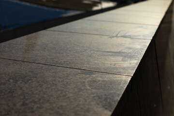 Obraz premium Granite tiles. Facade cladding. Details of building.