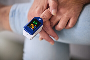 Pulse oximeter, healthcare and woman taking her heart rate in a retirement home during...