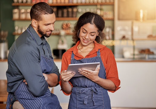 Restaurant, cafe teamwork and couple with tablet to manage orders, inventory and stock check. Diversity, waiter technology and man and woman with digital touchscreen for managing sales in coffee shop