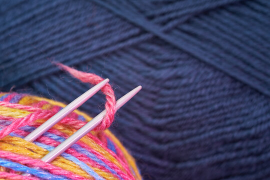 Tangle of knitting wool. Knitting needles.