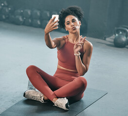 Fitness, selfie and woman on a gym floor with phone, peace and hand sign before exercise routine....