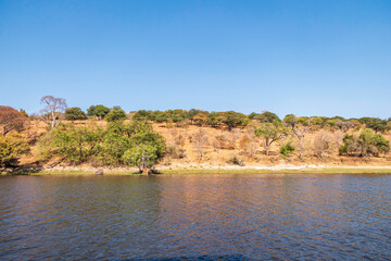 View of the banks and waters of the Chobe River in the Chobe National Park in Botswana.