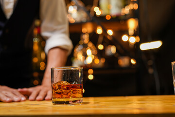 
Bartender pouring Whiskey, on  bar
