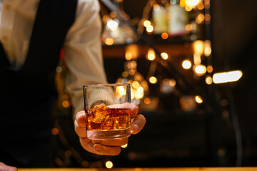 Bartender pouring Whiskey, on  bar,