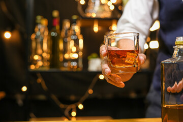 Bartender pouring Whiskey, on  bar,
